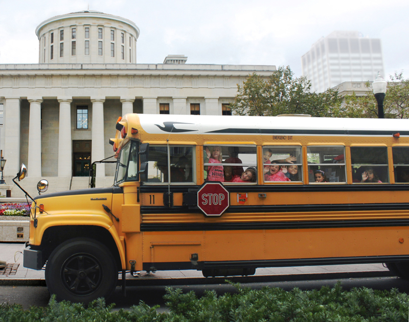 Bus driving past Statehouse